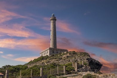 a stone tower on a hill