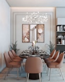 a dining room with a chandelier and chairs