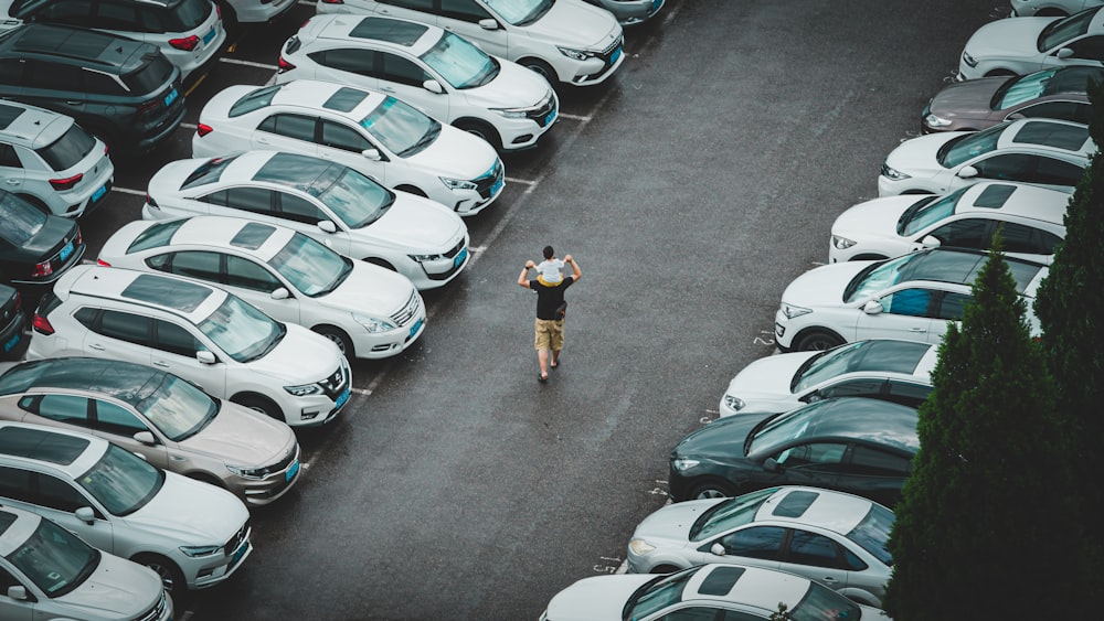 a person standing in a parking lot