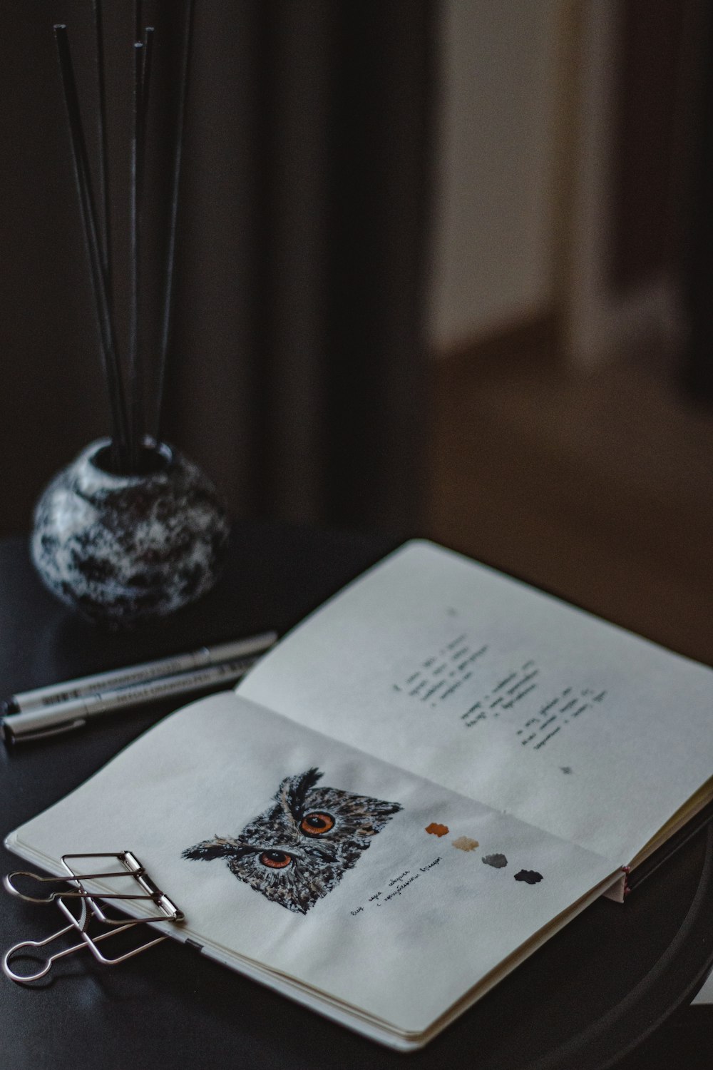 a book and glasses on a table