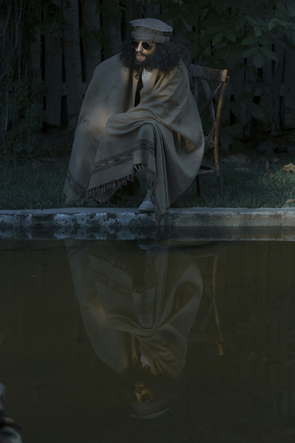 a person sitting in a chair outside