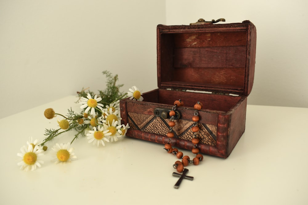 a wooden box with flowers in it