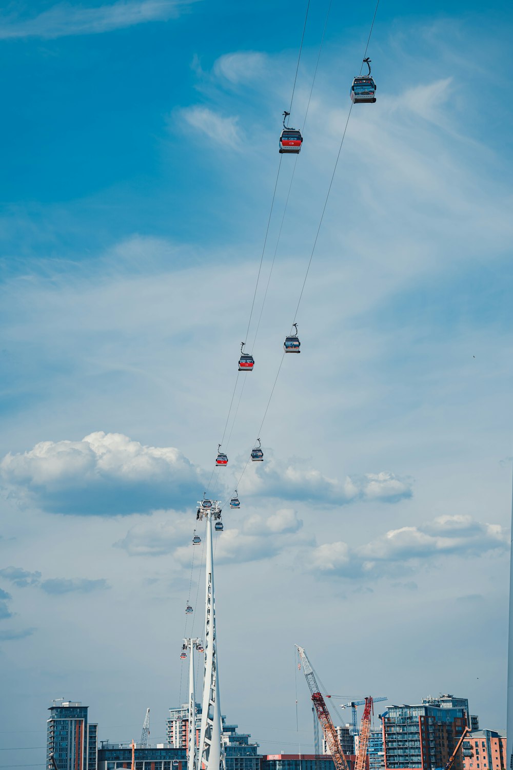 a group of people riding on a cable car