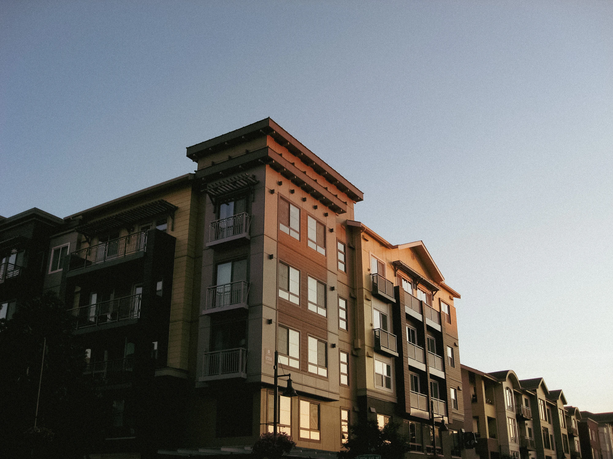 Small brick apartment building in evening light
