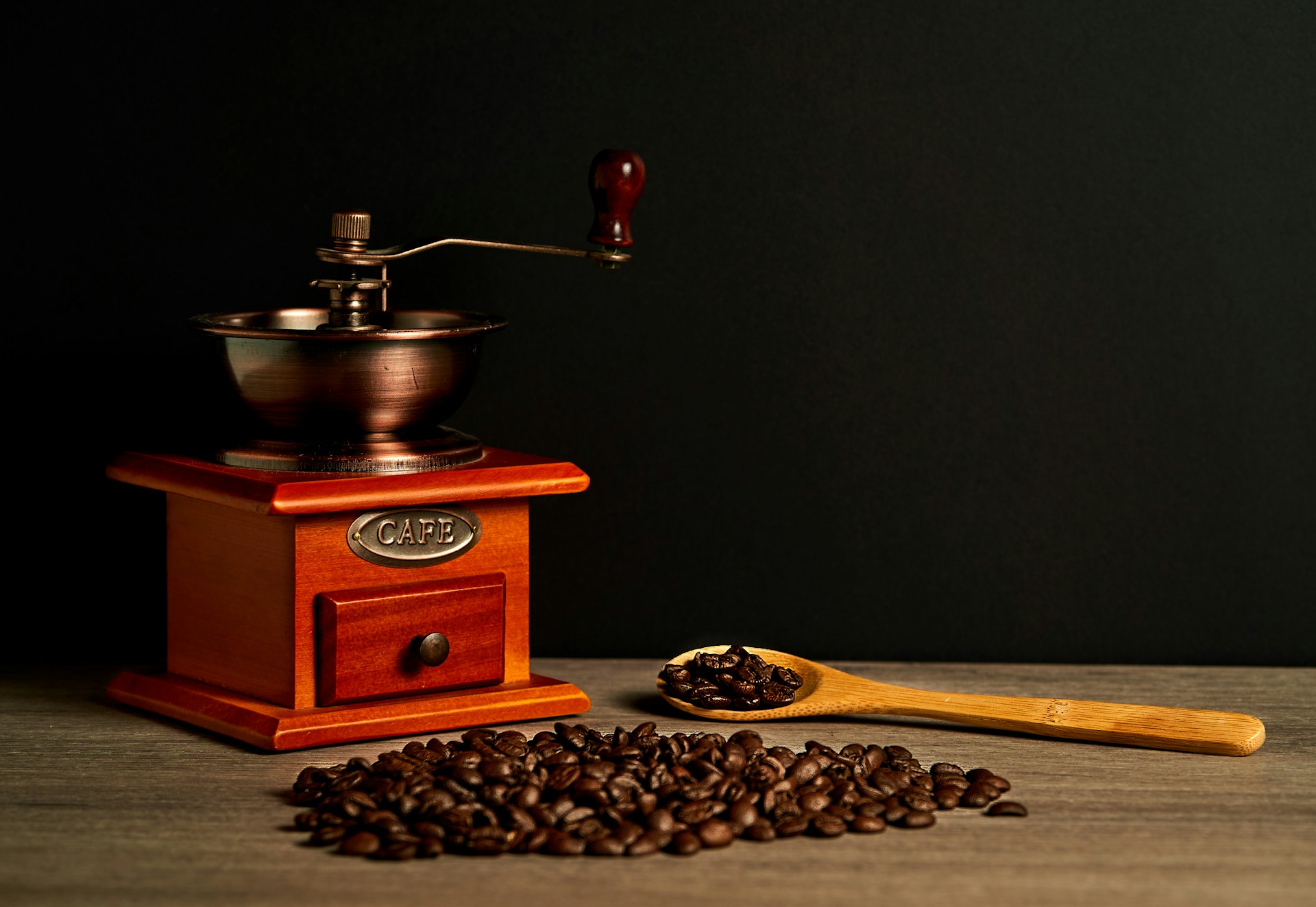 a wooden box with a wooden spoon and a wooden box with a wooden spoon and a wooden spoon