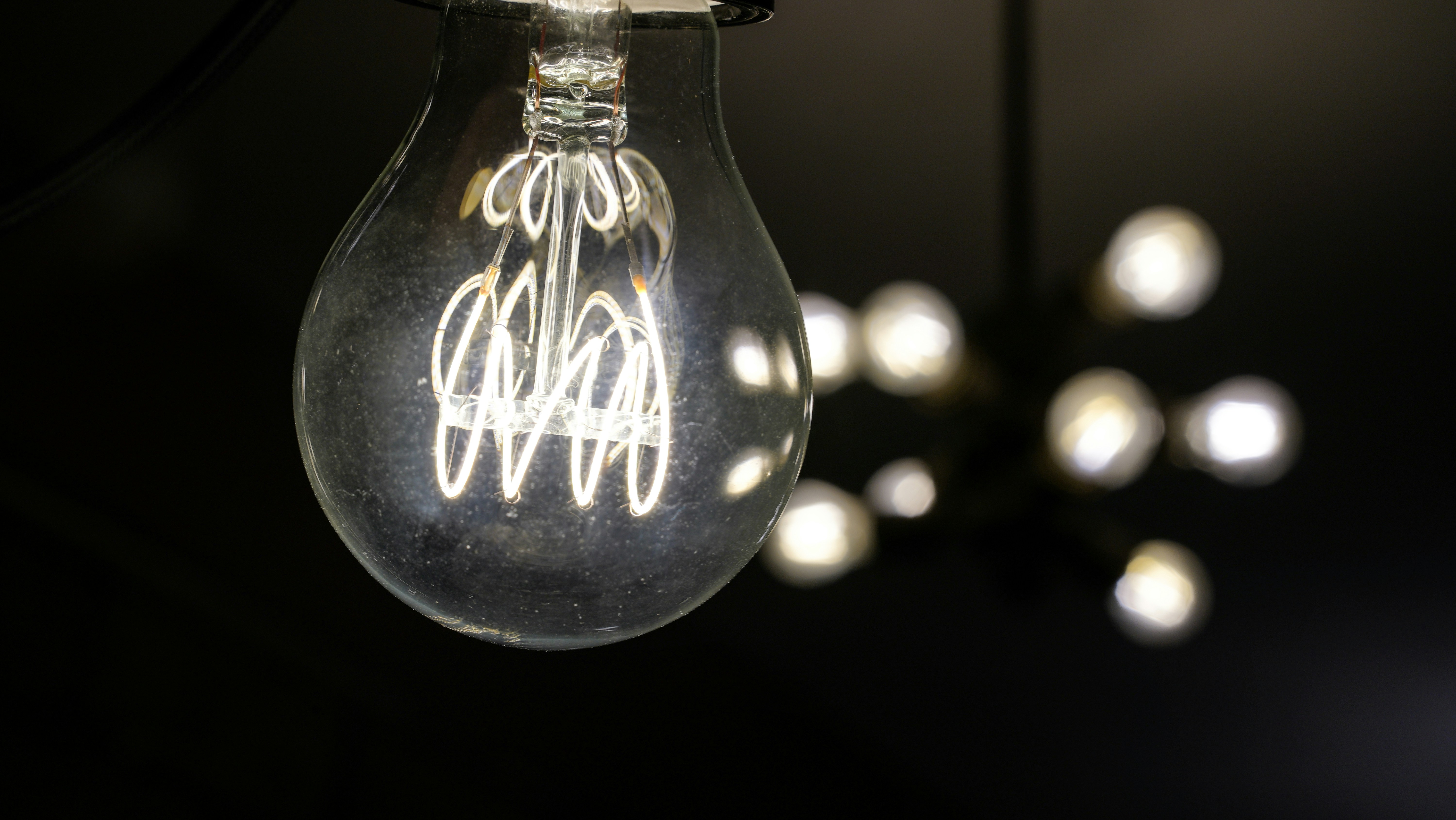 a glass bottle with a white label