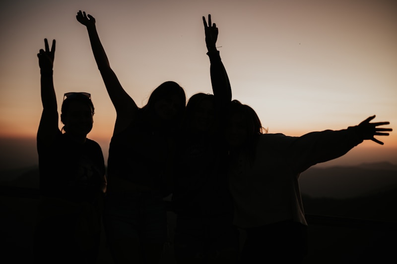 a group of people raising their hands