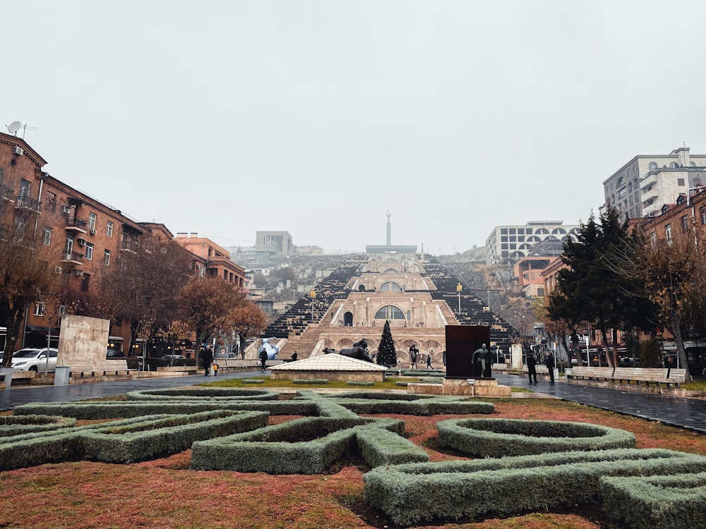 a courtyard with a building in the background