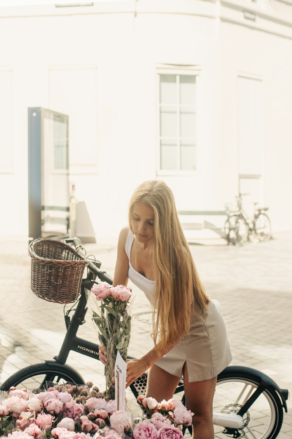 a woman sitting on a bicycle