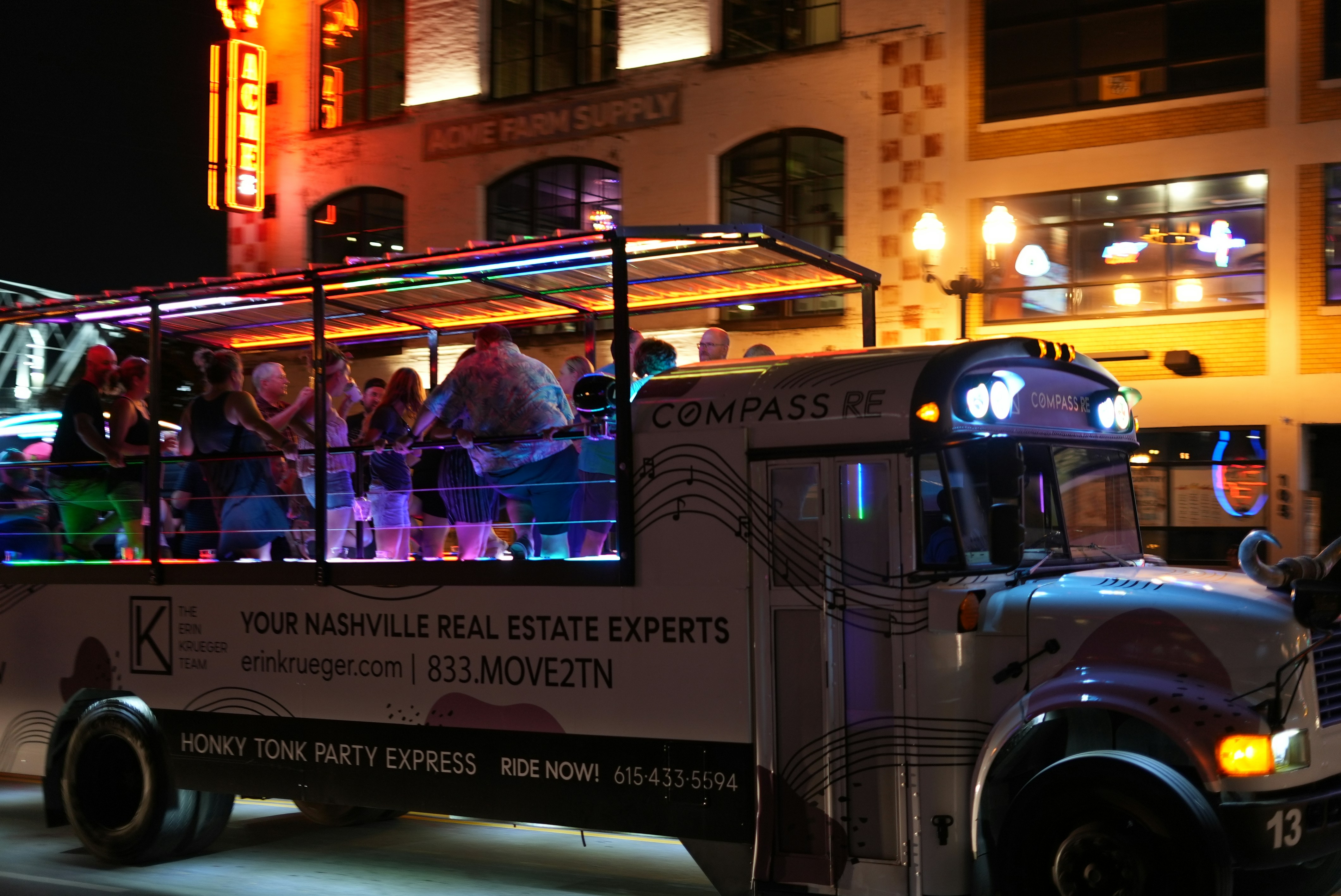 Luxury party bus with LED lighting exterior at night