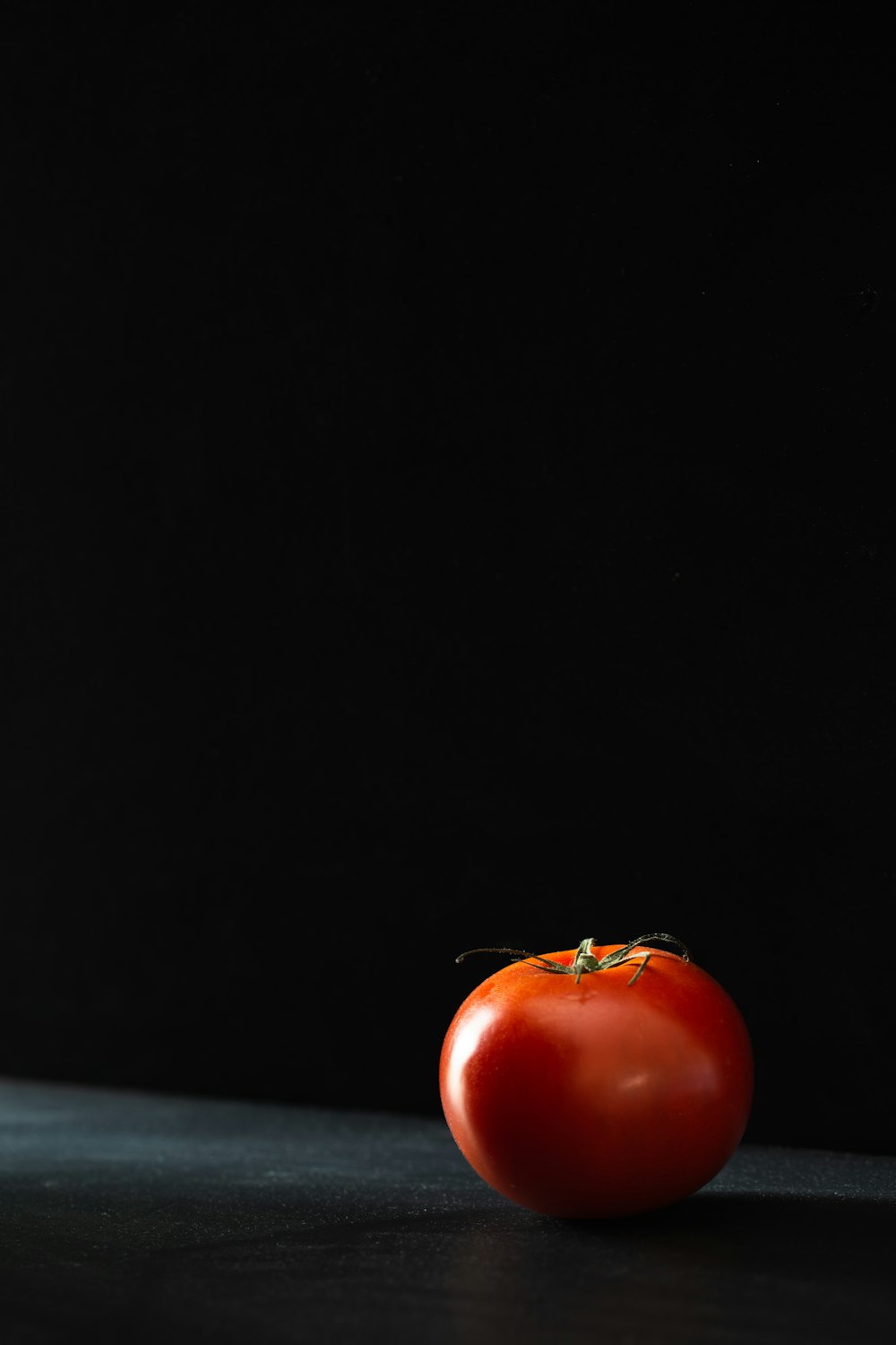 a red apple with a bug on it