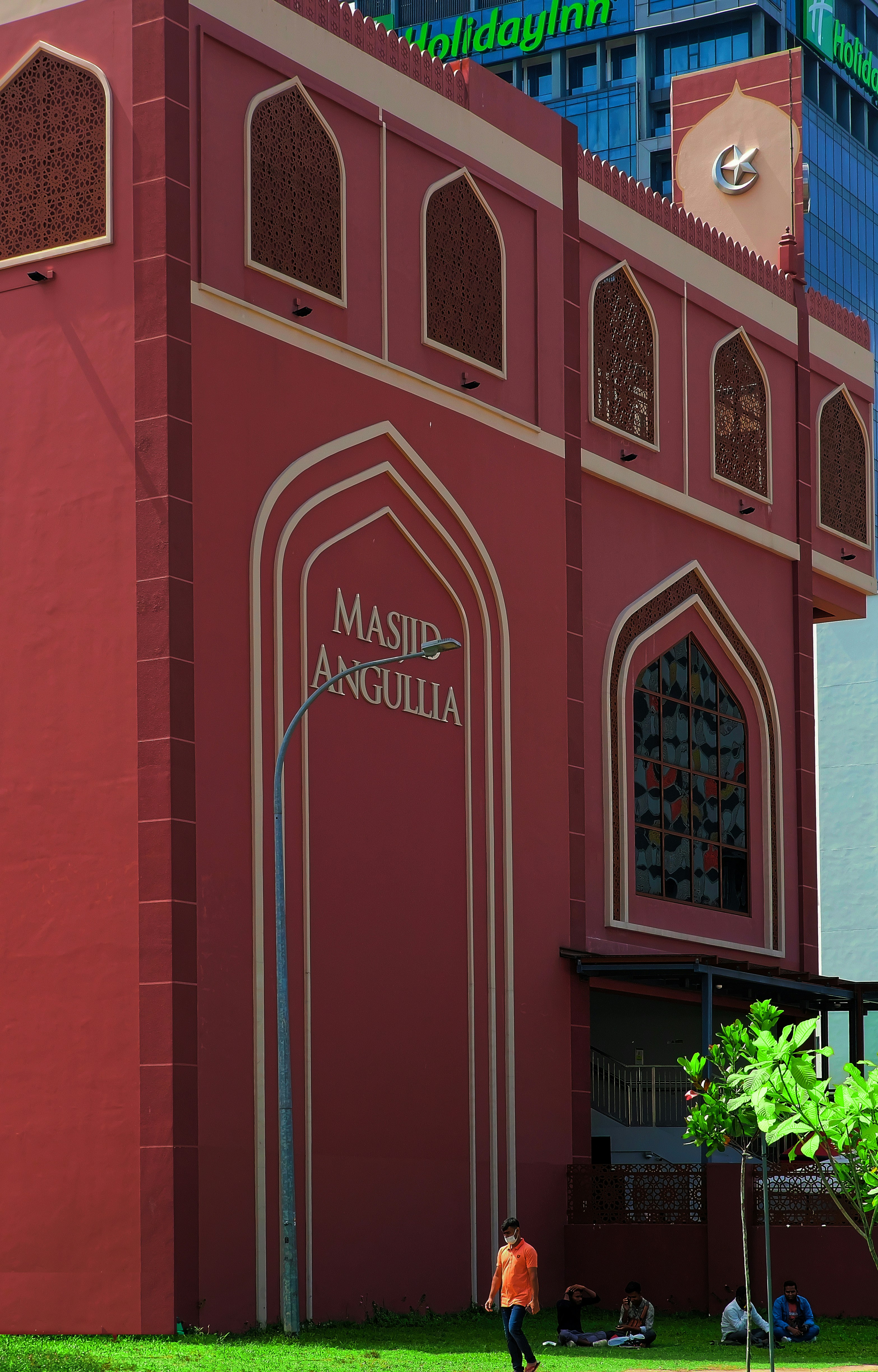 a person walking in front of a building