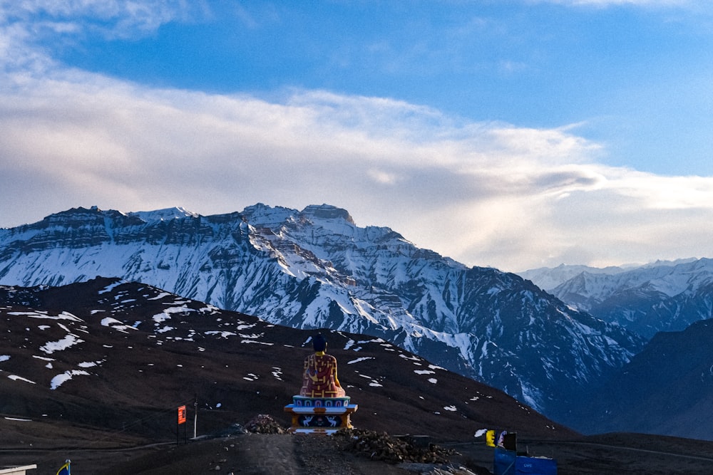 a statue on a mountain