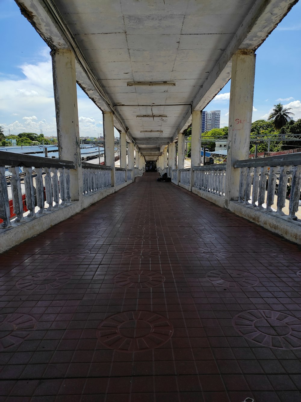 a walkway with a walkway and a bridge over it