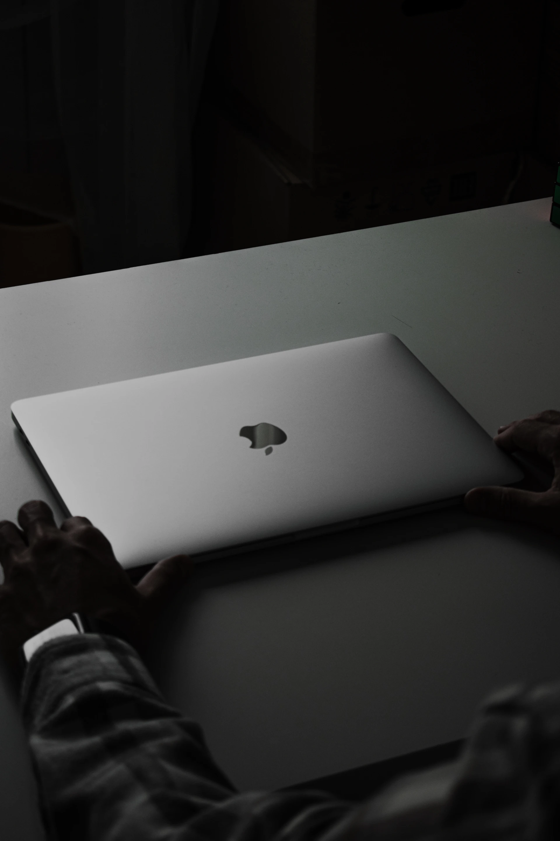 a person holding a laptop