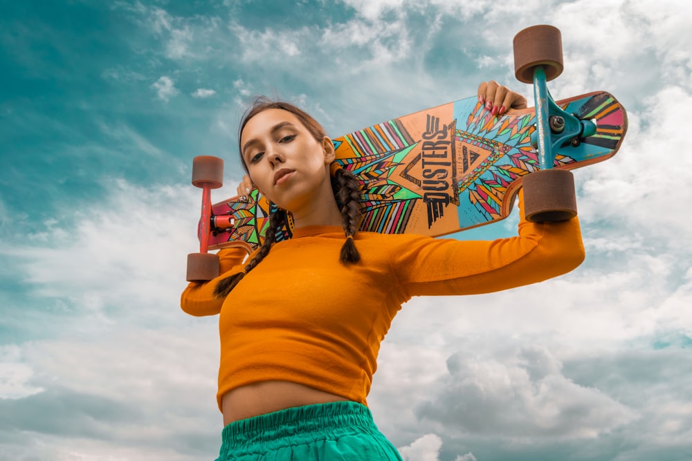 a person holding a skateboard