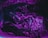 Wrinkled purple plastic material with glossy texture, highlighted by a mix of pink and blue hues in moody lighting.