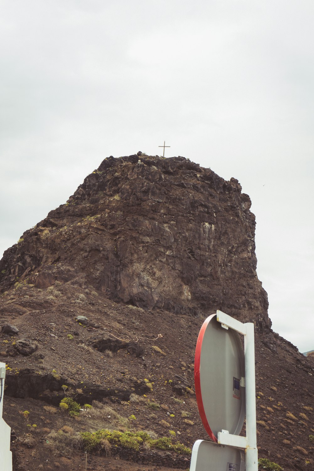 a rock with a cross on top