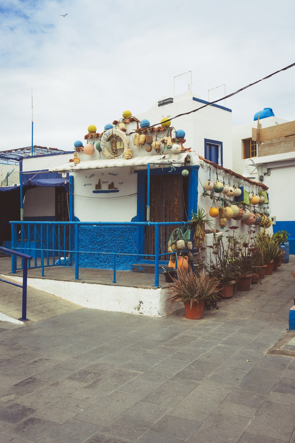 a blue and white building with a clock on it