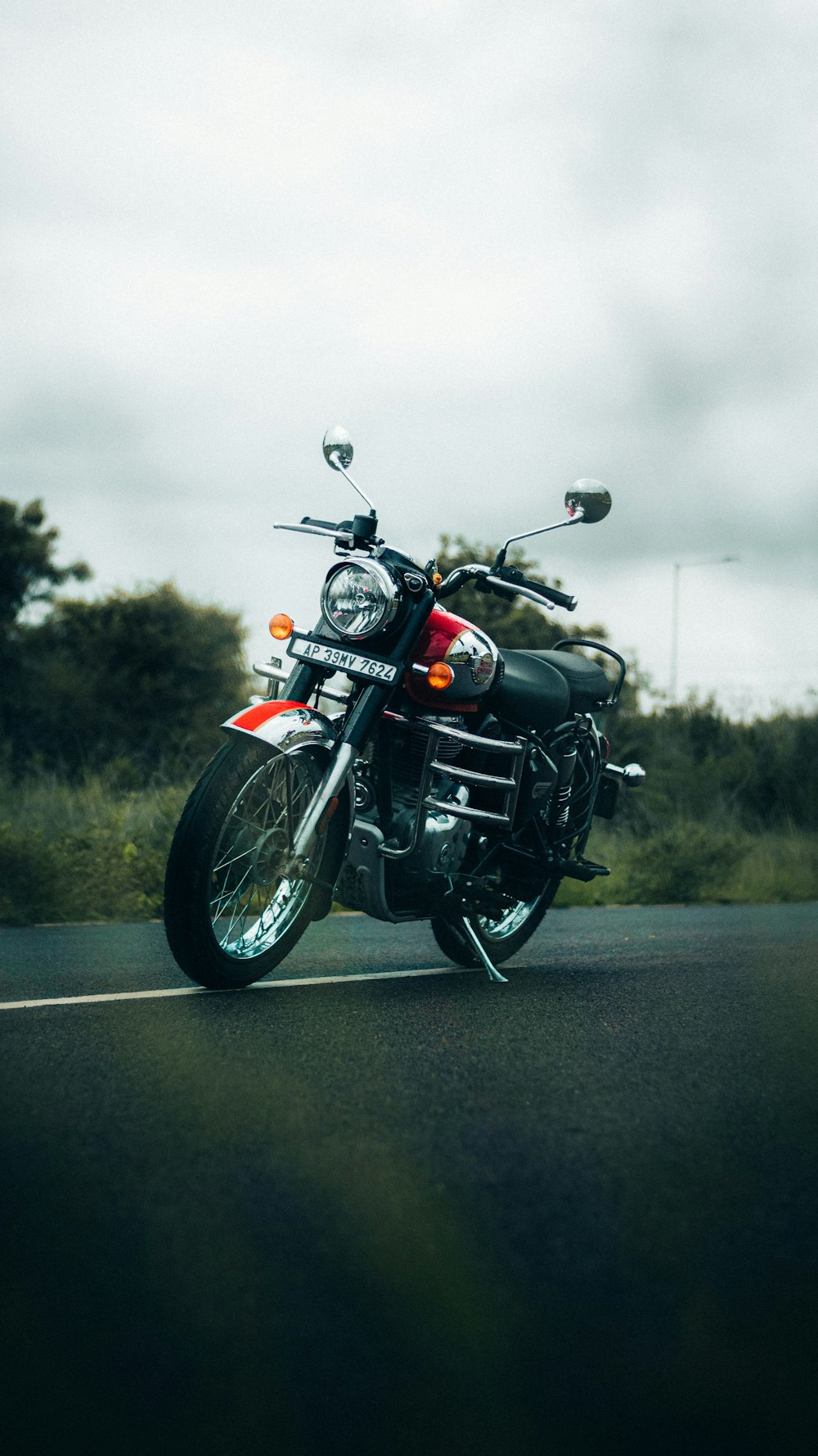 a motorcycle parked on the side of a road