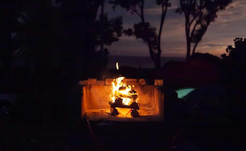 a fire pit with a flame