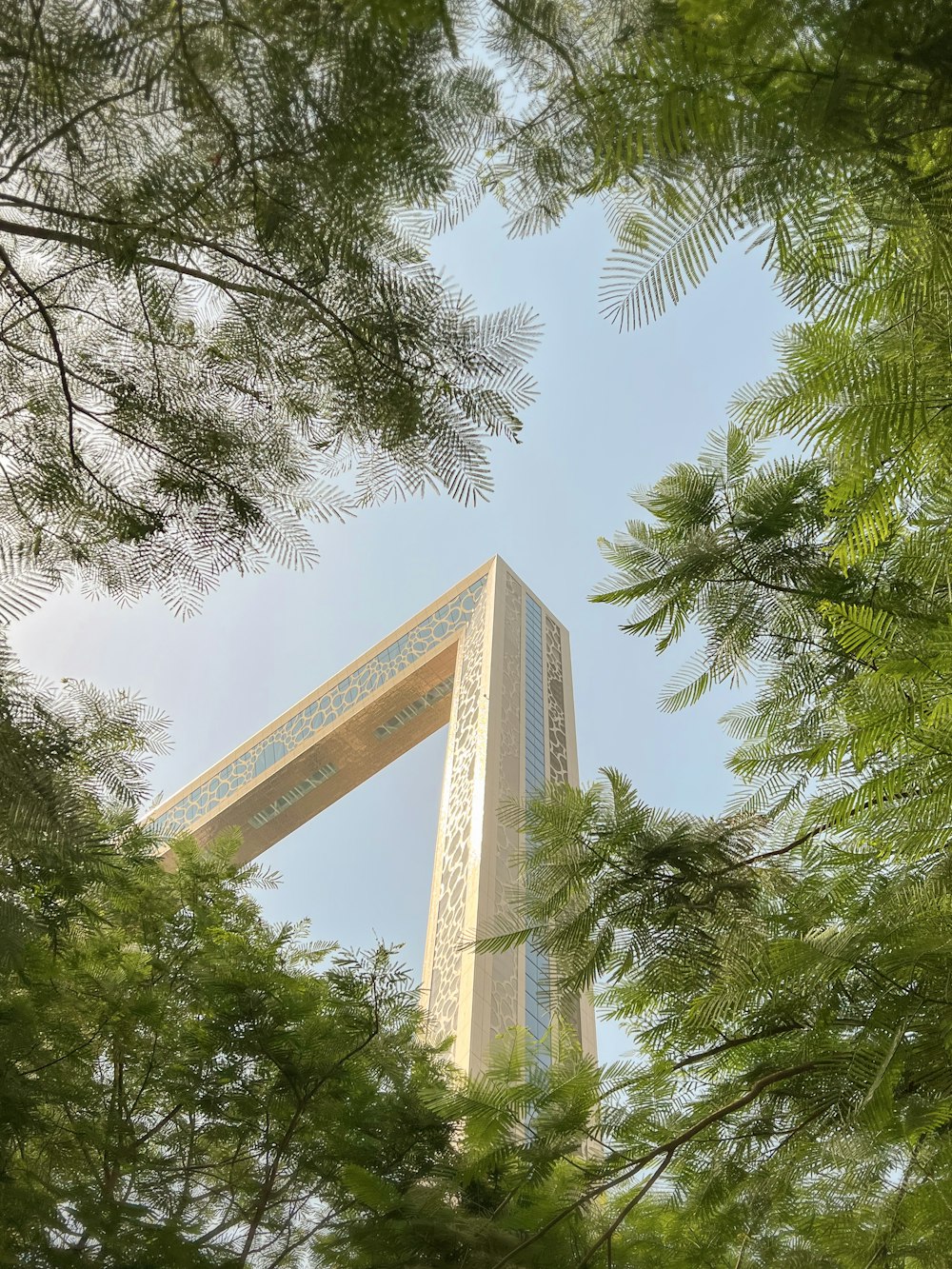 a tall building with trees around it