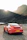 Toyota Supra parked on a mountain road during sunset, showcasing its sleek lines.