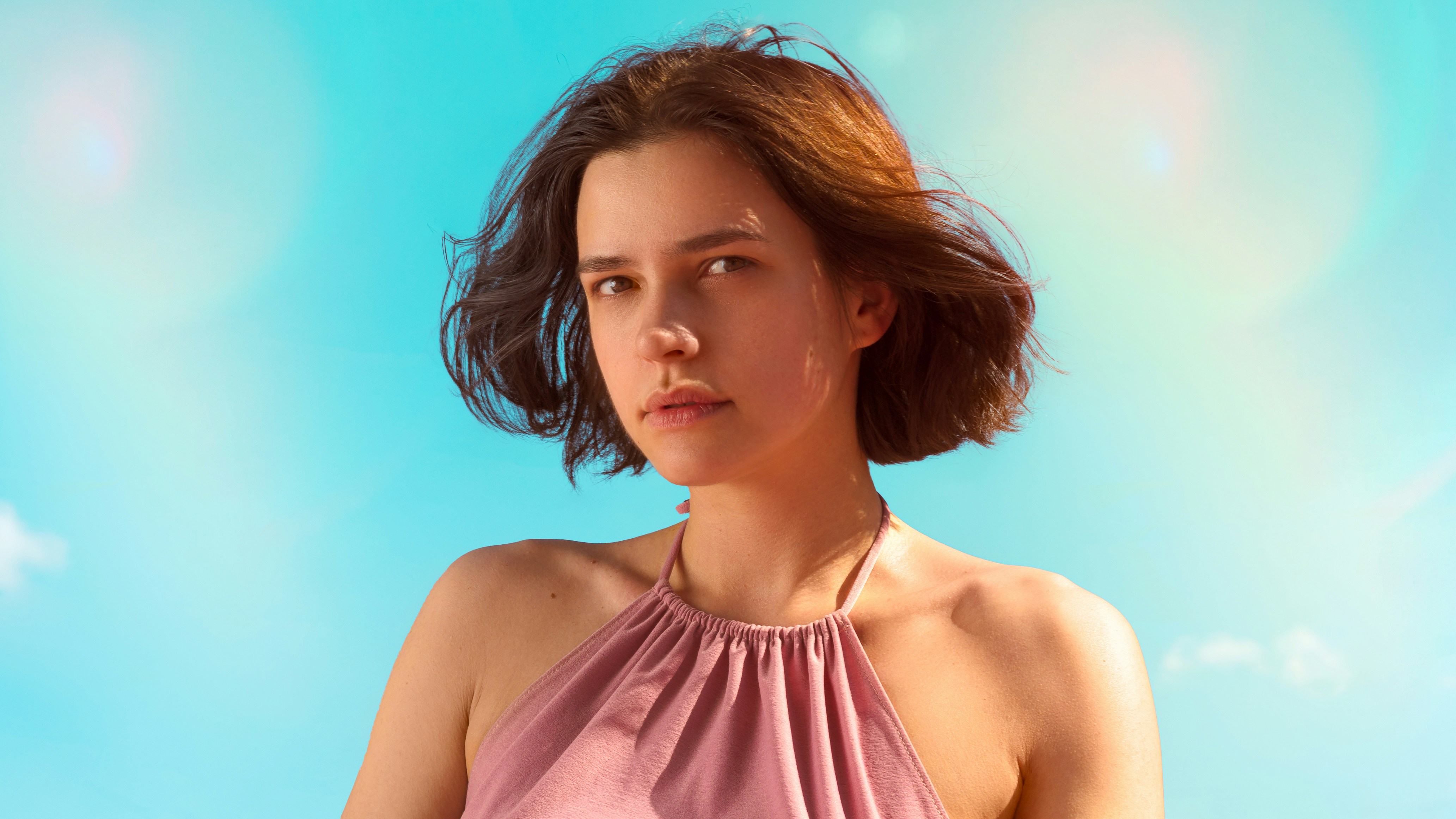 a person with a pink top