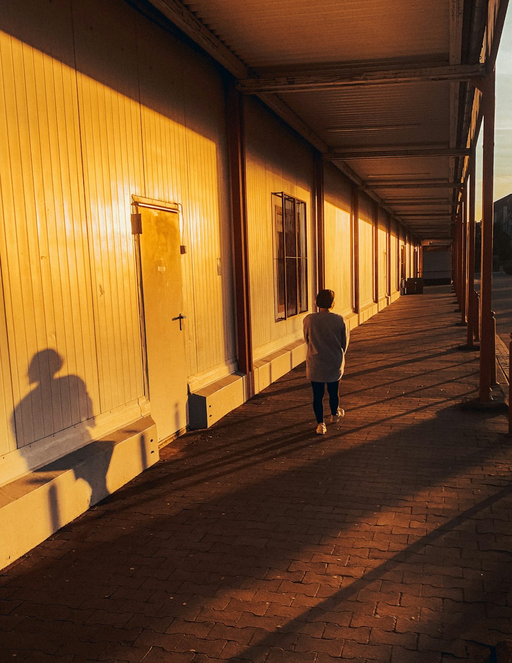 a person walking on a brick path