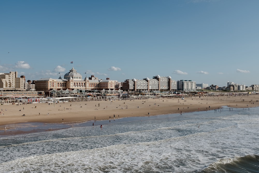 a beach with buildings in the background