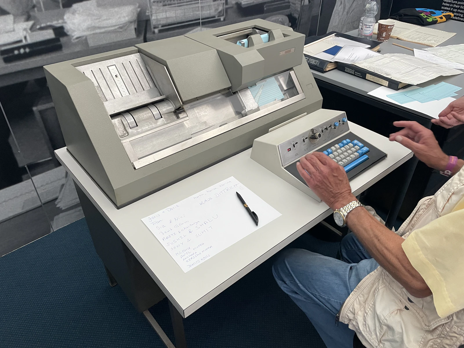 Analyst working through documents and data at a desk