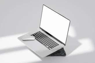 Minimalist black and white website layout on a laptop screen.
