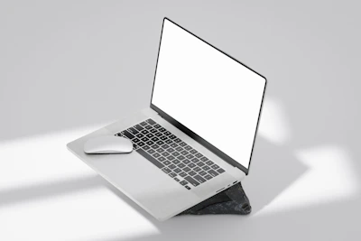 Minimalist black and white website layout on a laptop screen.