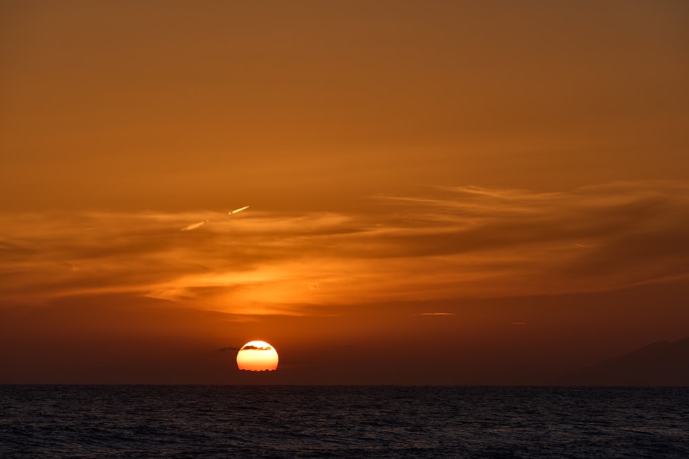 a sunset over a body of water