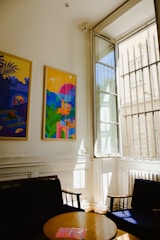 A vibrant metal print hanging perfectly on a living room wall, framed by natural light.