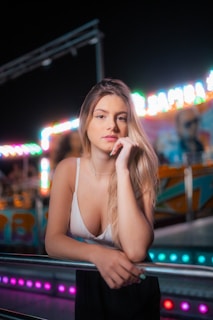 a woman with her hand on her chin