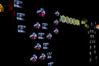 A dimly lit room with a glowing screen displaying fragmented data and patterns.