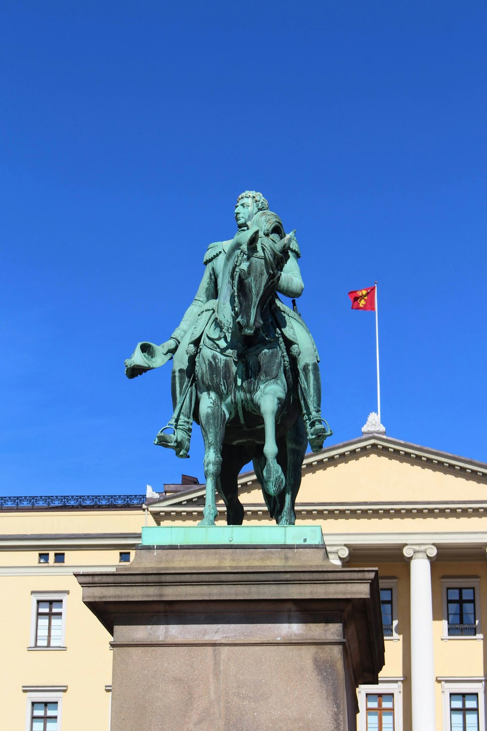 a statue of a person on a horse