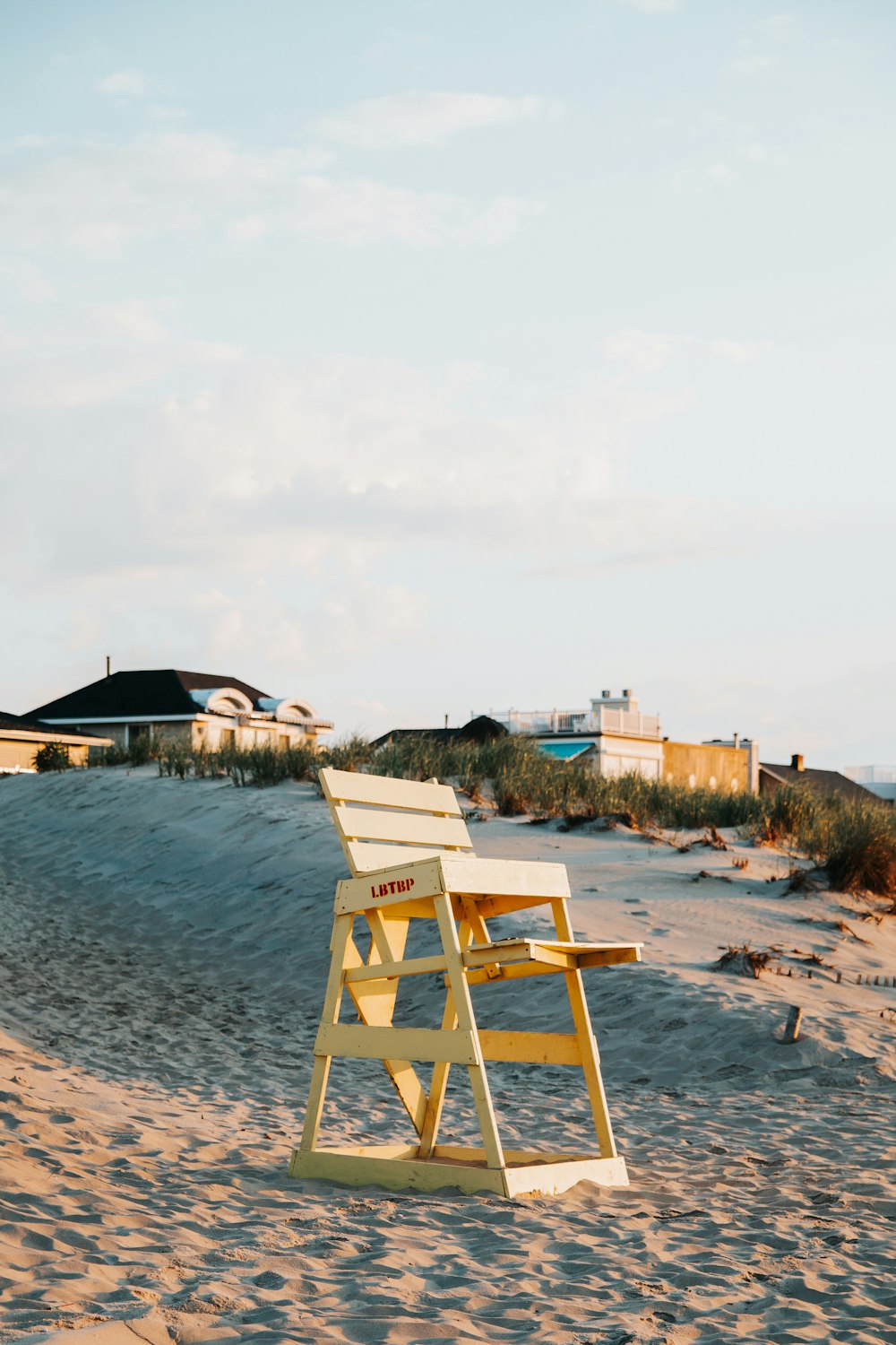 a chair sitting in front of a body of water