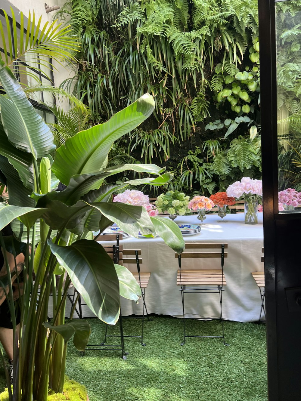 a table with flowers and plants