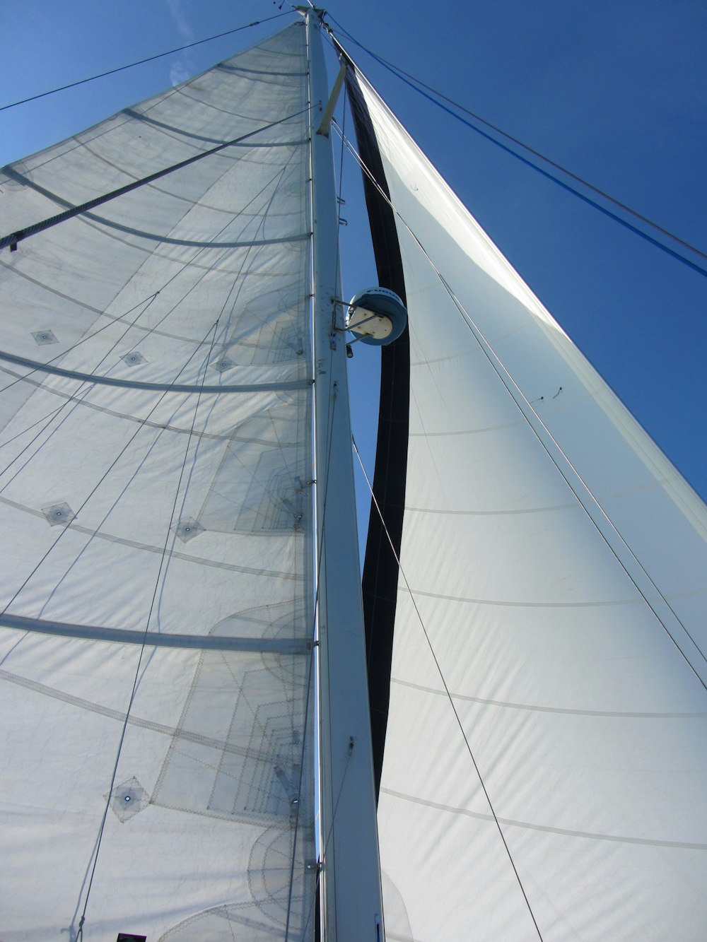 a sailboat with a person on the deck