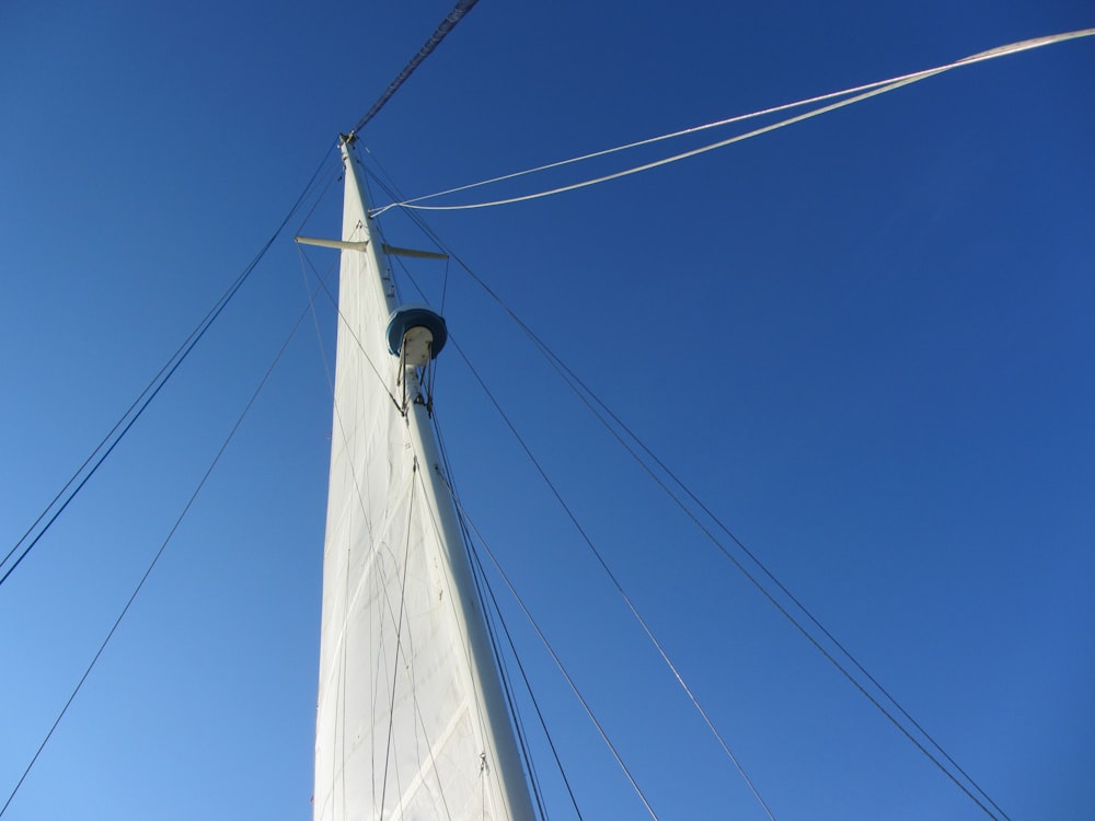a white sailboat with cables