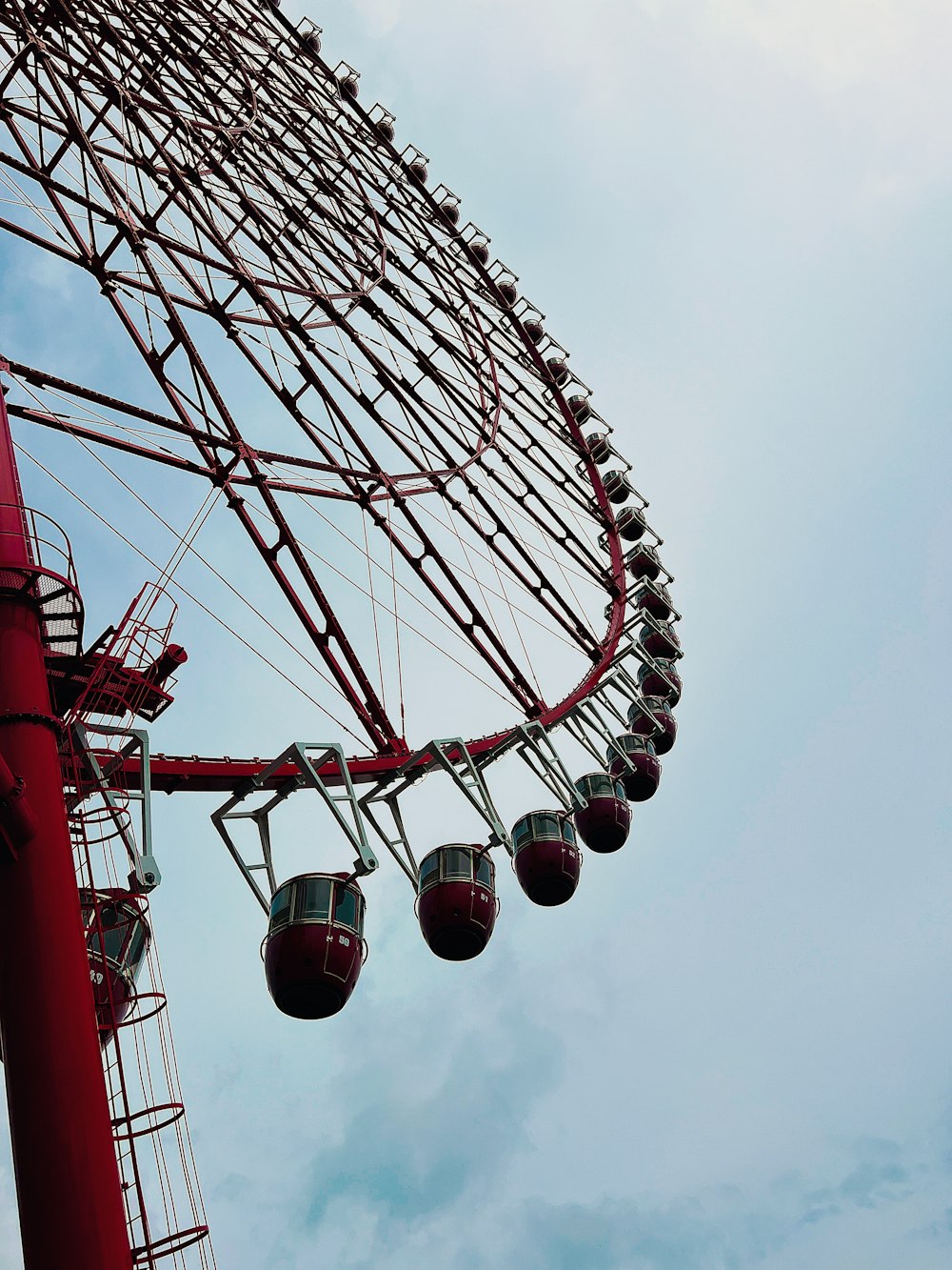 a ferris wheel with red and blue sky