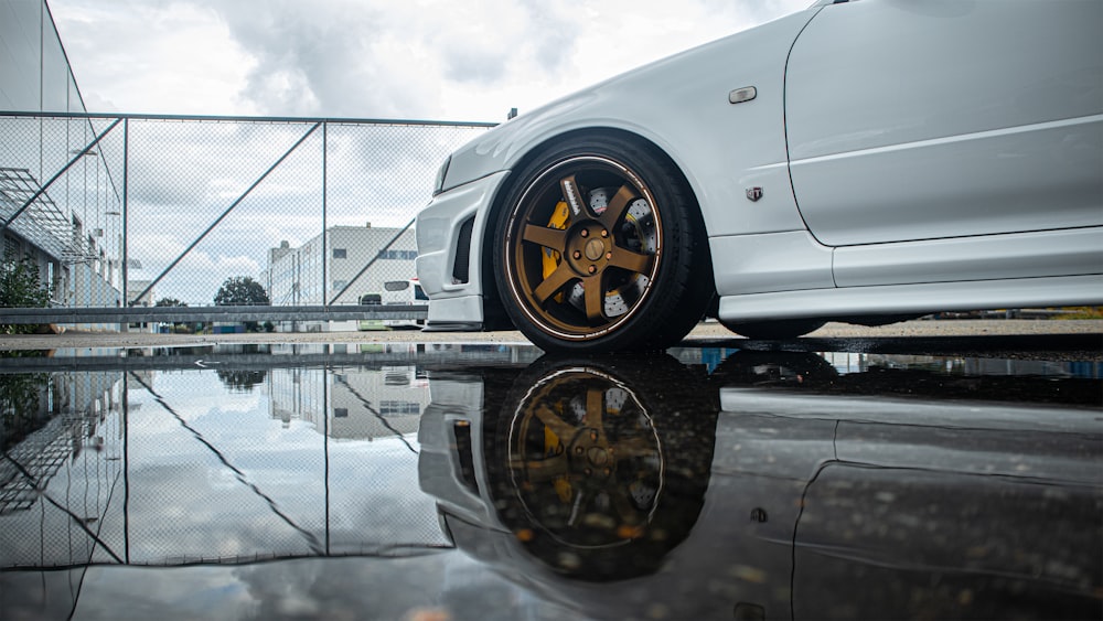 a car parked on a wet road