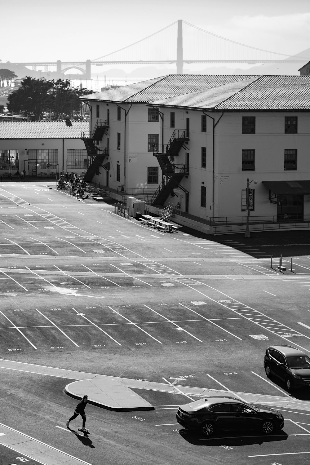 a person skateboards across a crosswalk