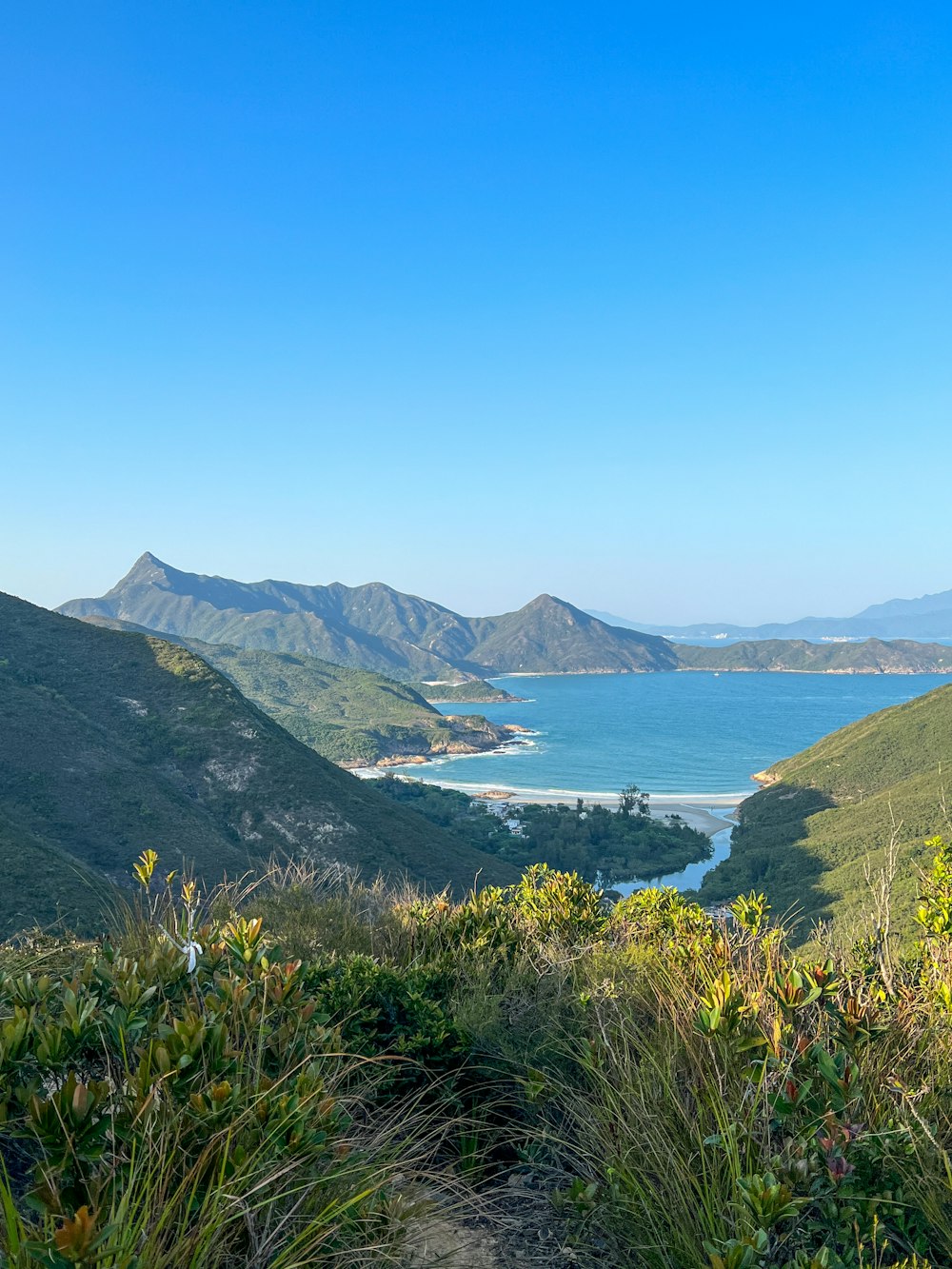 a body of water with hills around it