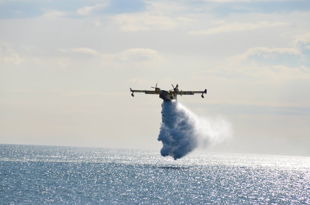 a plane flying over the ocean