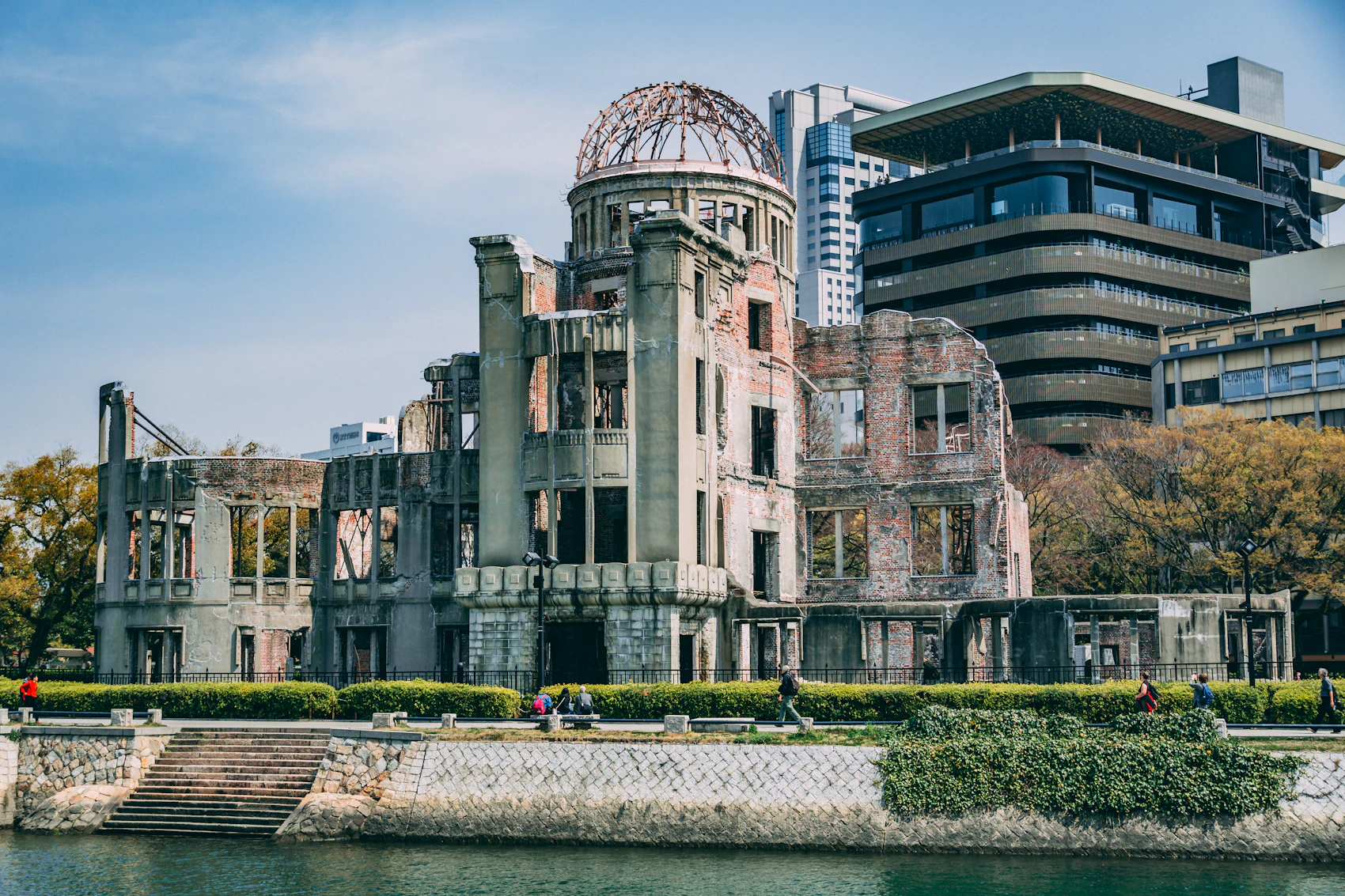 The preserved Atomic Bomb Dome beside the river in modern Hiroshima