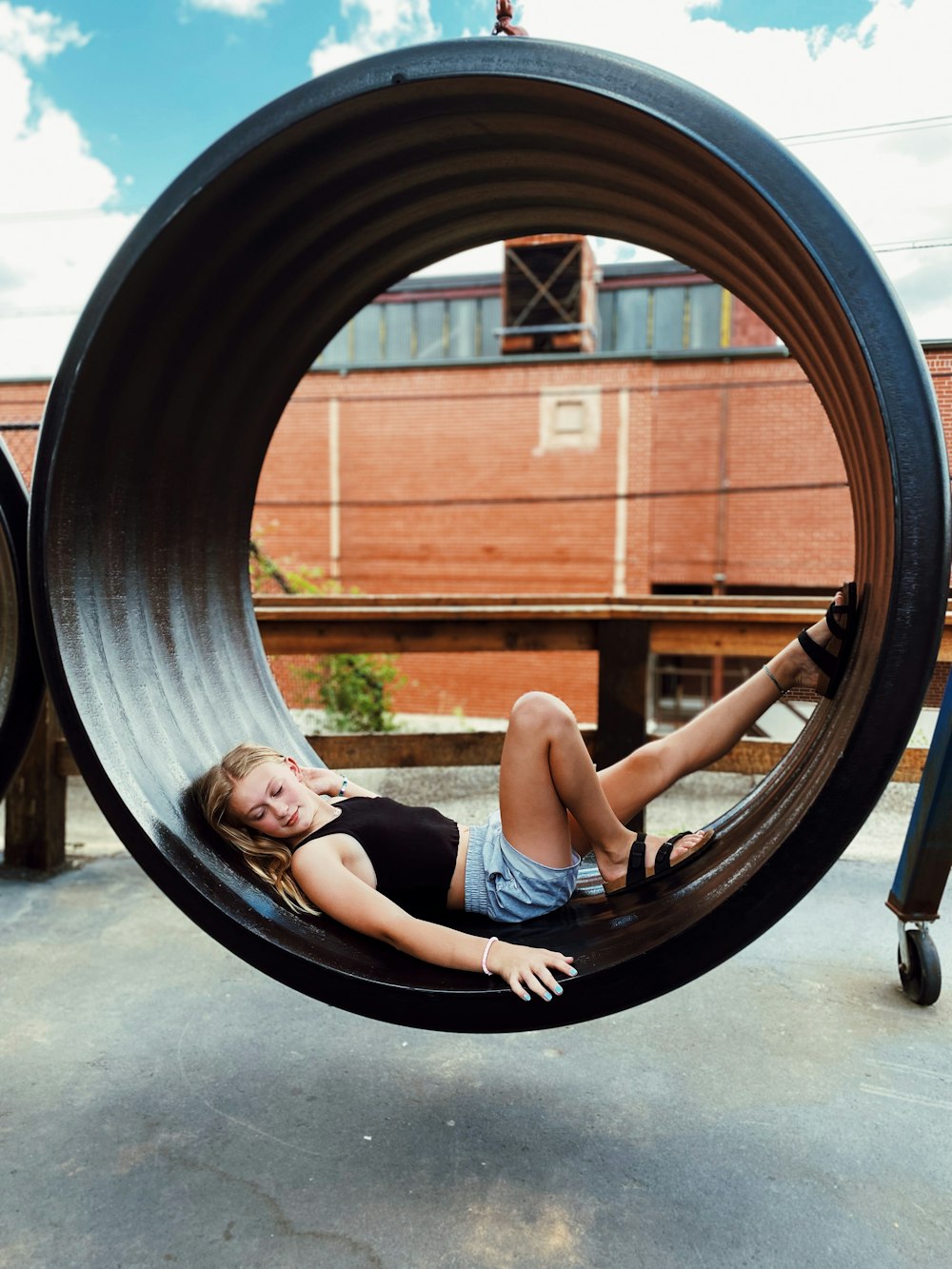 a person lying on a circular object