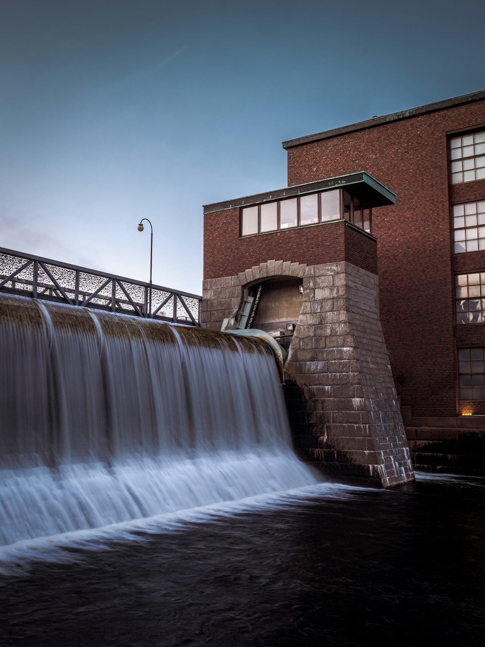 a large water fountain next to a building